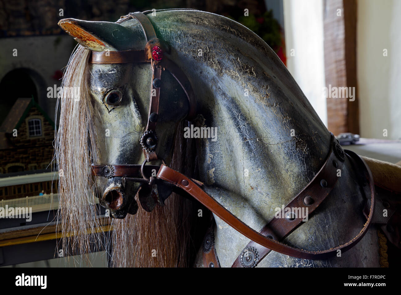 The rocking horse in the Nursery at Eyam Hall and Craft Centre, Derbyshire. Eyam Hall is an unspoilt example of a gritstone Jacobean manor house, set within a walled garden. Stock Photo