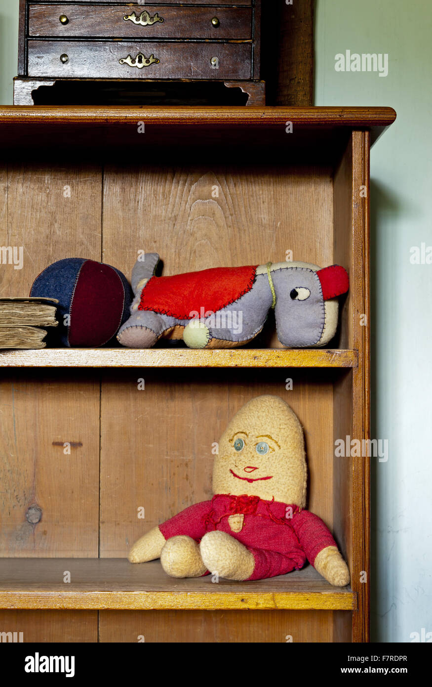 Toys on shelves in the Nursery at Eyam Hall and Craft Centre, Derbyshire. Eyam Hall is an unspoilt example of a gritstone Jacobean manor house, set within a walled garden. Stock Photo