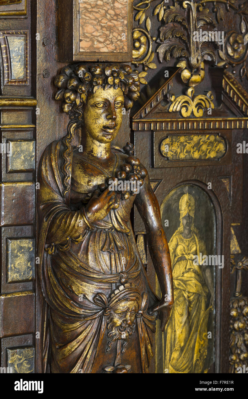 Detail of gilded, carved decoration on a French sixteenth-century cabinet, in the Withdrawing Chamber, Hardwick Hall, Derbyshire. Dating from around 1580, the cabinet's design was derived from an engraving by Jacques I Androuet du Cerceau, and also bears Stock Photo