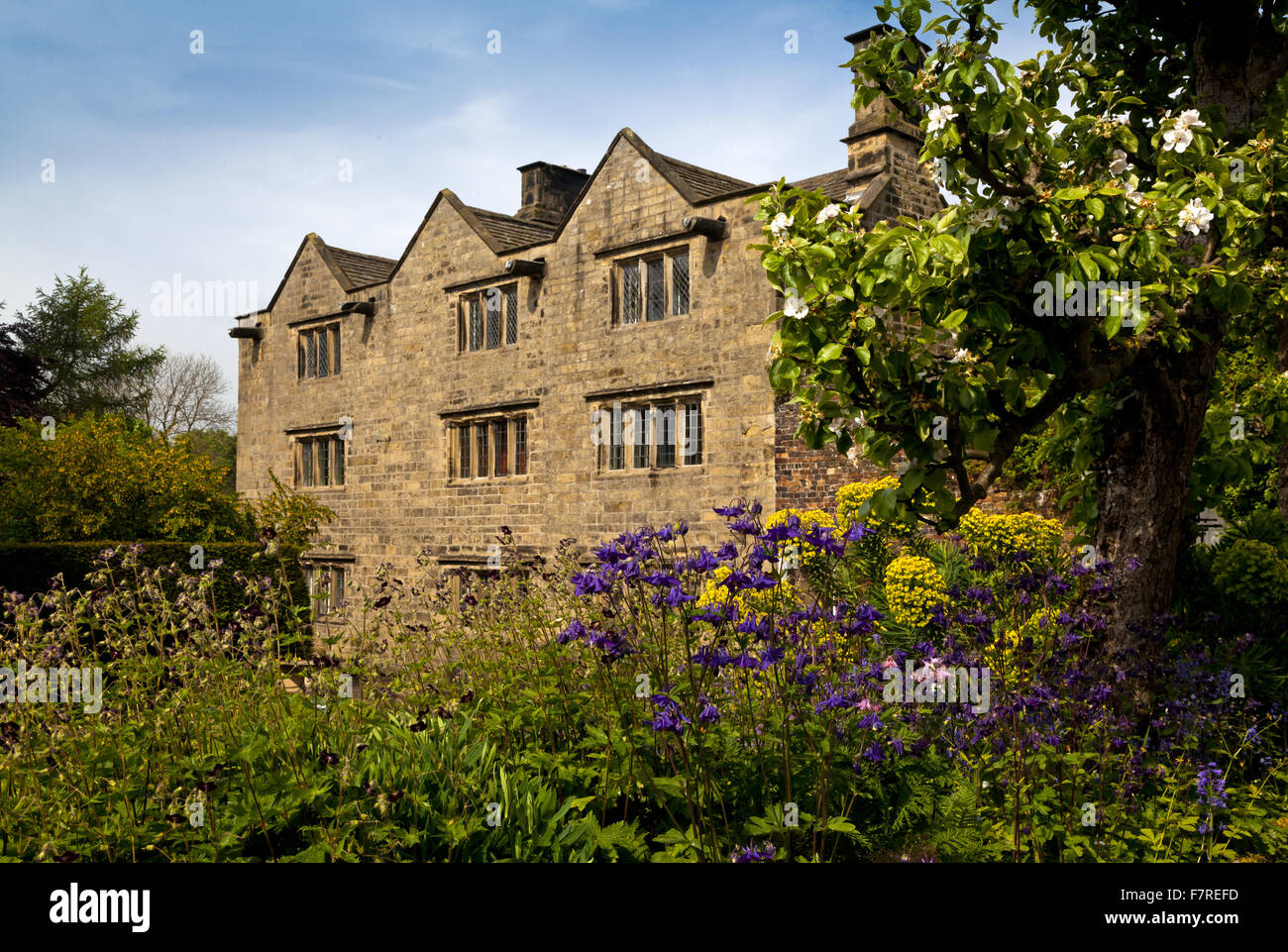 The garden at the front of Eyam Hall and Craft Centre, Derbyshire. Eyam Hall is an unspoilt example of a gritstone Jacobean manor house, set within a walled garden. Stock Photo