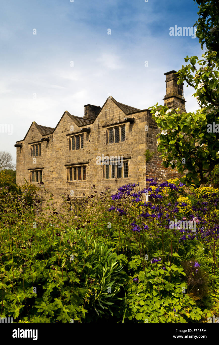 The garden at the front of Eyam Hall and Craft Centre, Derbyshire. Eyam Hall is an unspoilt example of a gritstone Jacobean manor house, set within a walled garden. Stock Photo