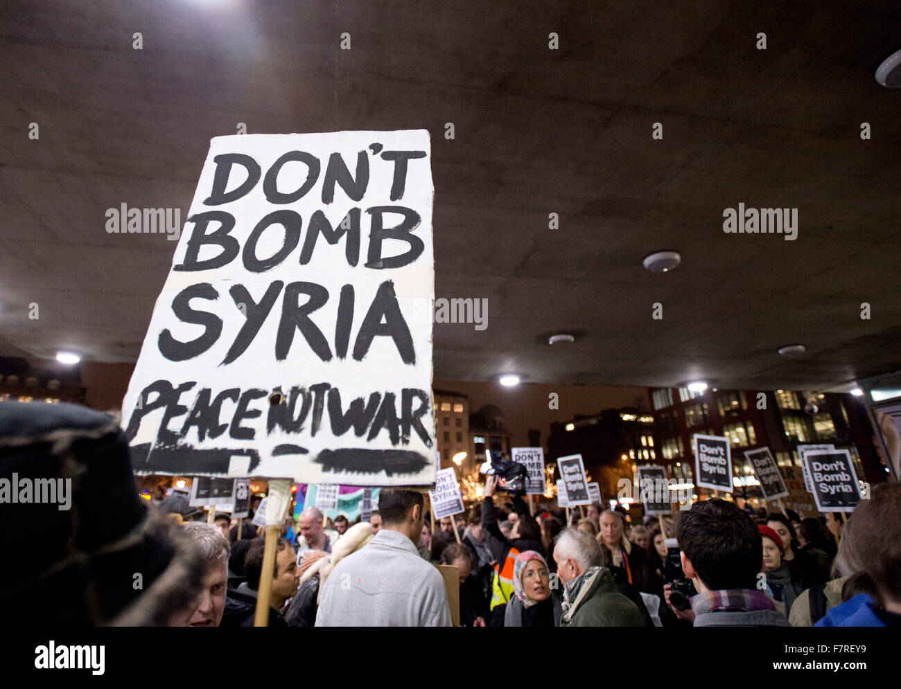 Manchester, UK. 2nd December, 2015. Protesters gather in the Piccadilly Gardens area of Manchester to call for MPs to vote against an action of bombing strategic ISIS targets in Syria. Credit:  Russell Hart/Alamy Live News Stock Photo