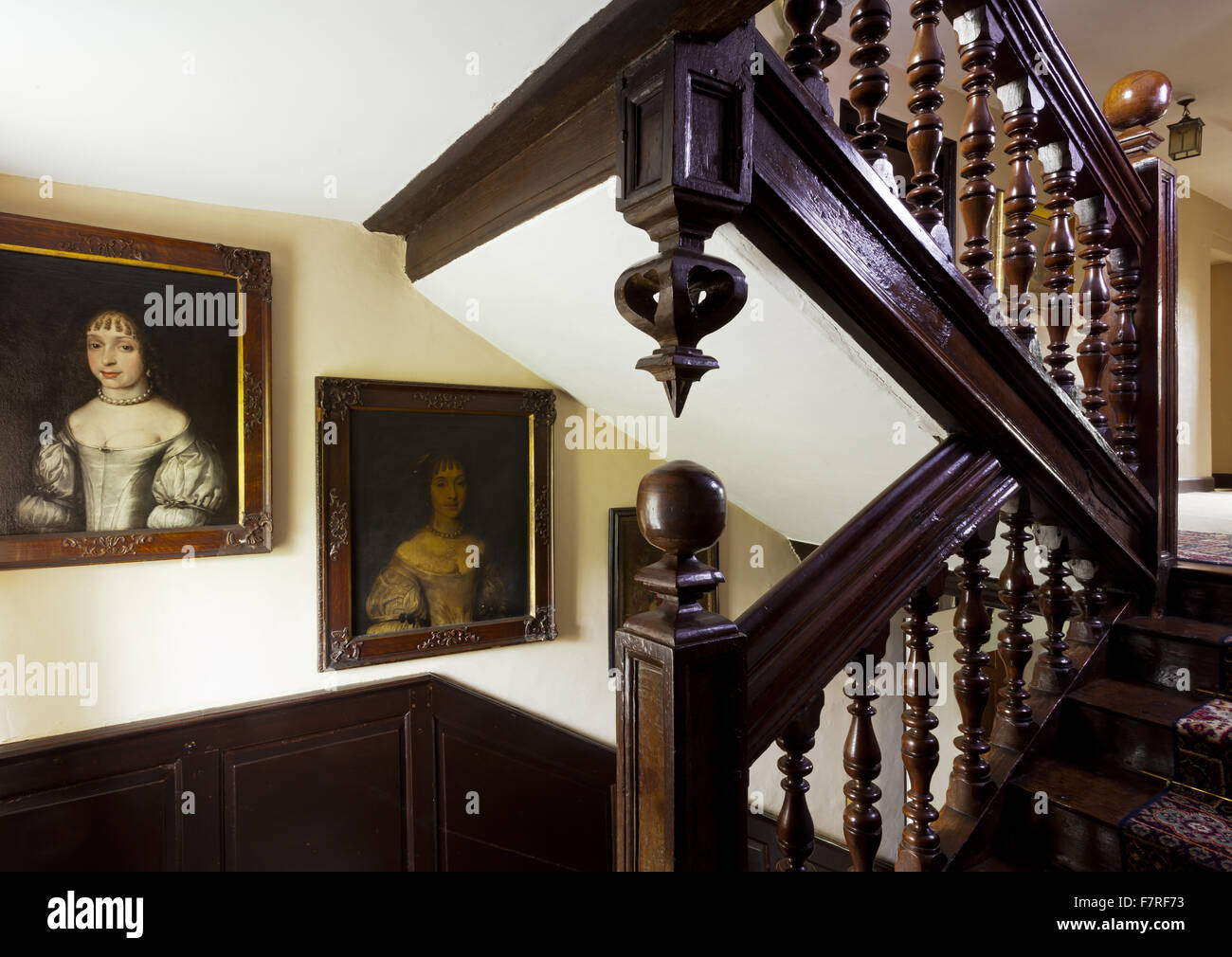 The main staircase at Eyam Hall and Craft Centre, Derbyshire. Eyam Hall is an unspoilt example of a gritstone Jacobean manor house, set within a walled garden. Stock Photo