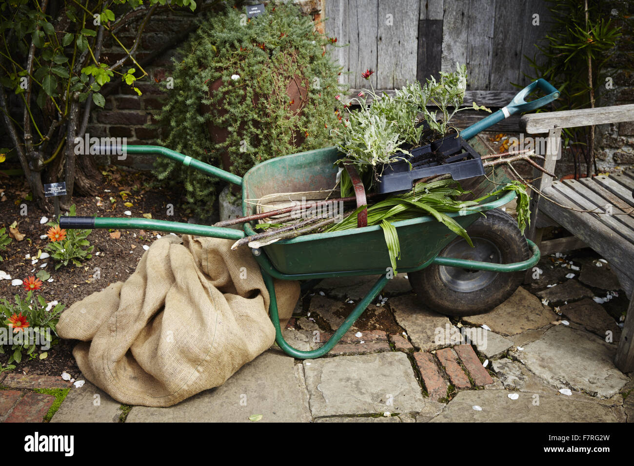 A wheelbarrow full of tools at Sissinghurst Castle Garden, Kent