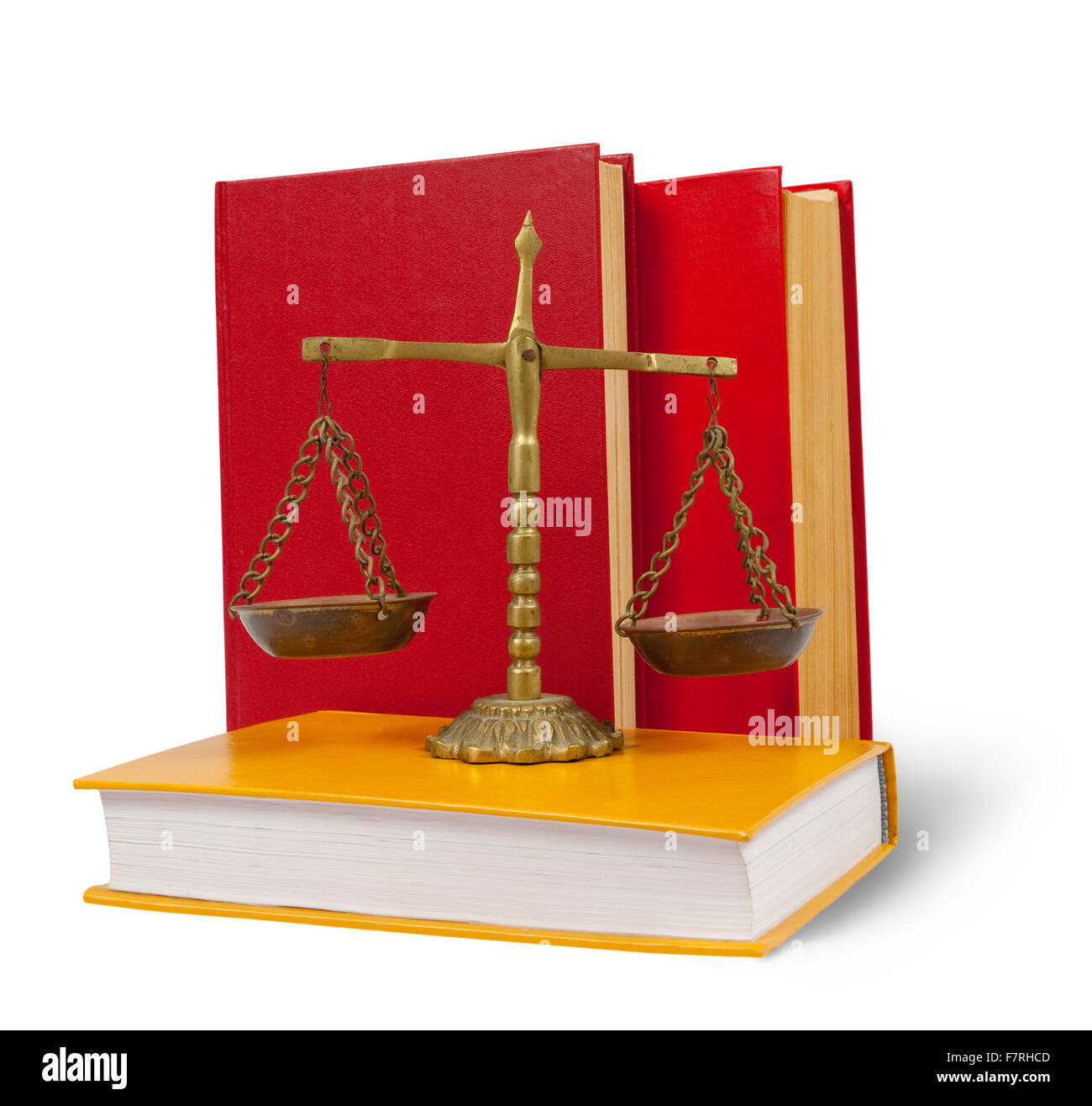 Brass scales of justice atop legal books over white Stock Photo - Alamy