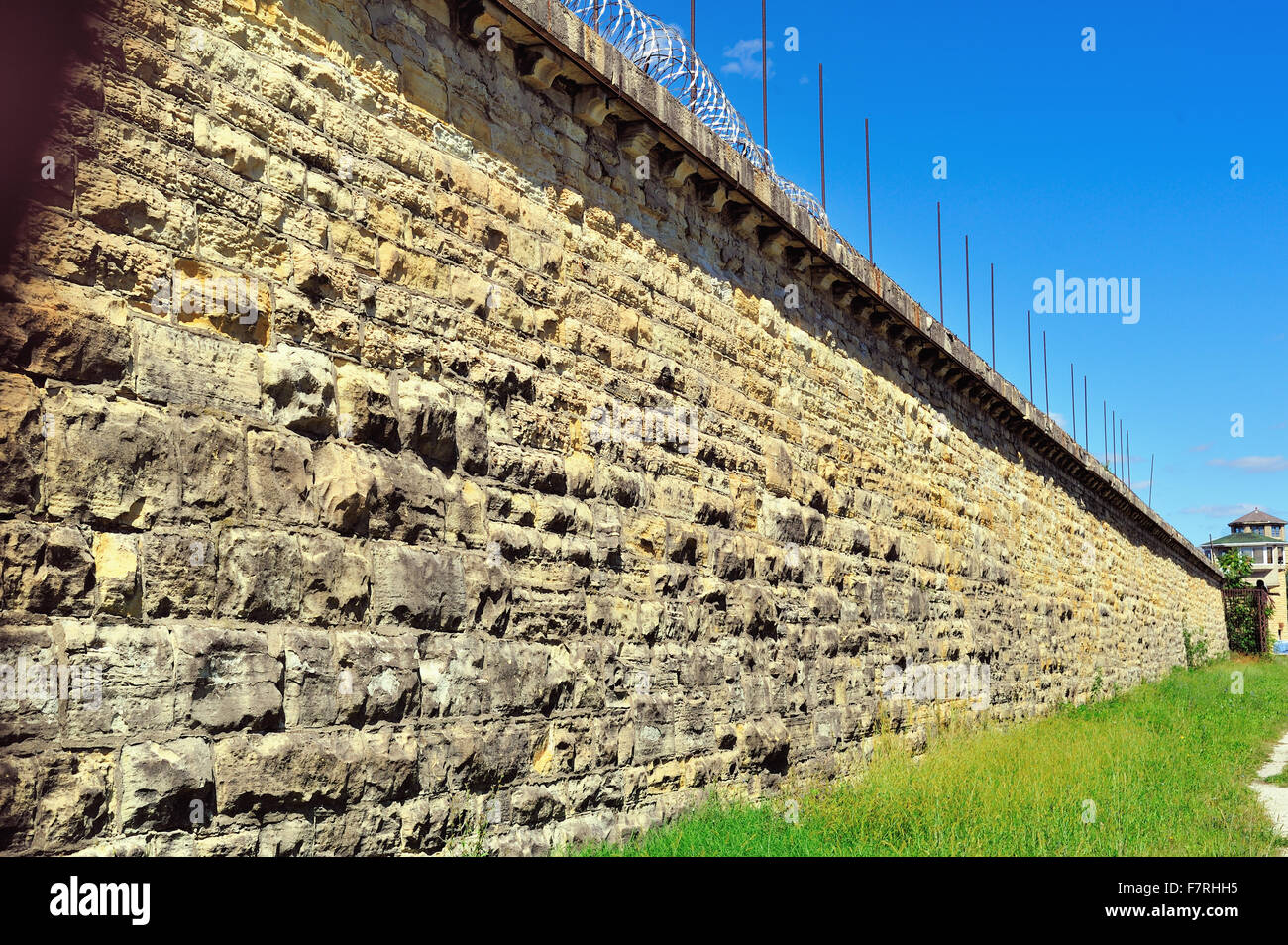 Wall and distant guard tower at the Joliet Correctional Center (also known as Illinois State Penitentiary and Joliet Prison). Joliet, Illinois, USA. Stock Photo
