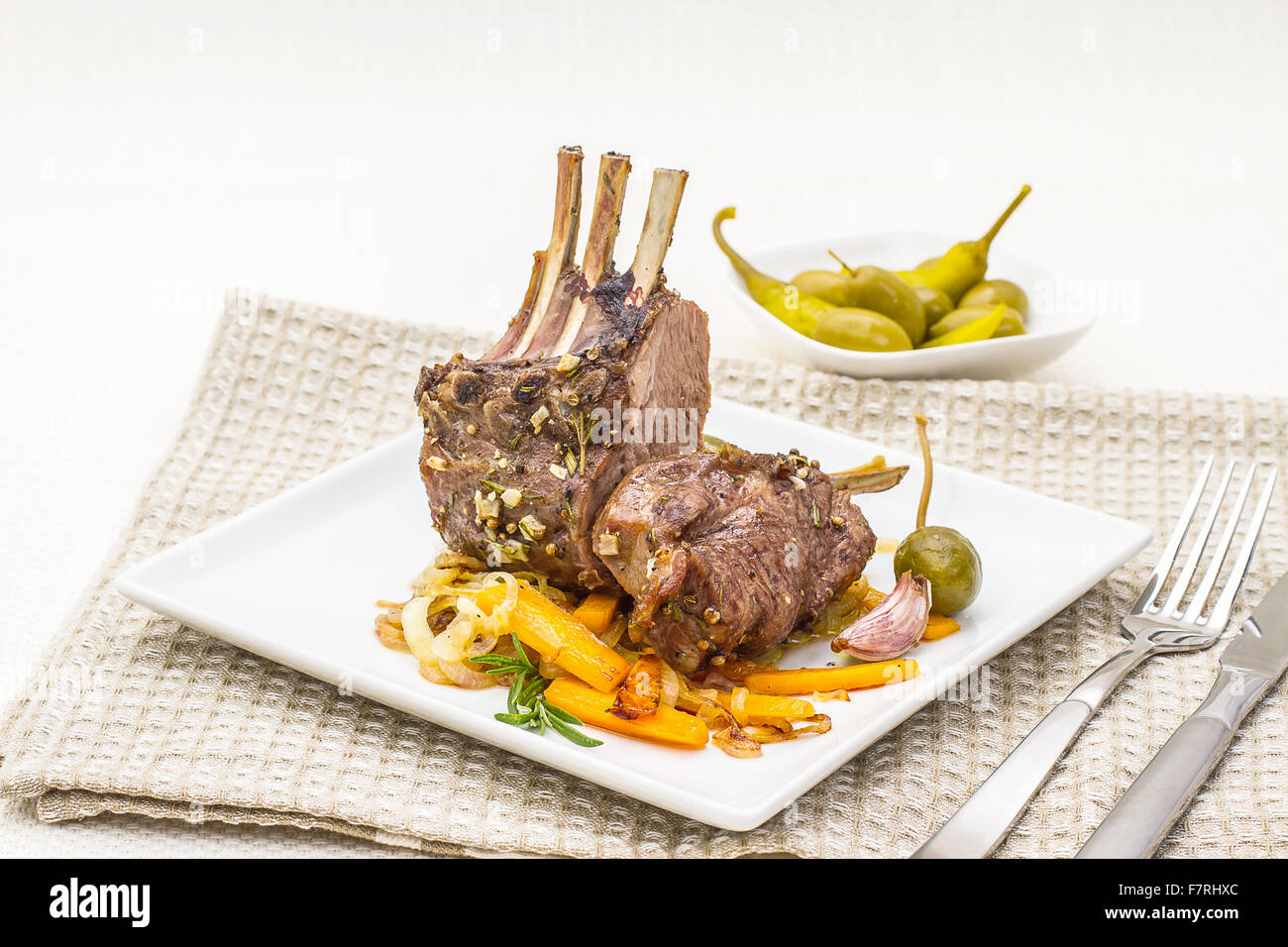 Grilled rack of lamb with carrot, onion, garlic and rosemary Stock