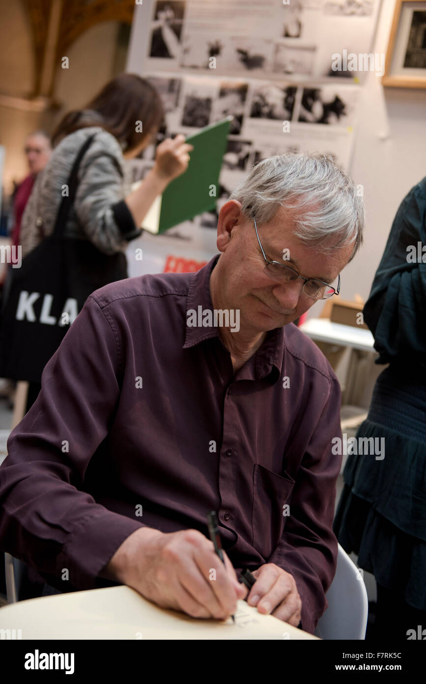 Noted Magnumphotographer, Martin Parr, signing his books at Paris Photo, Paris, France Stock Photo