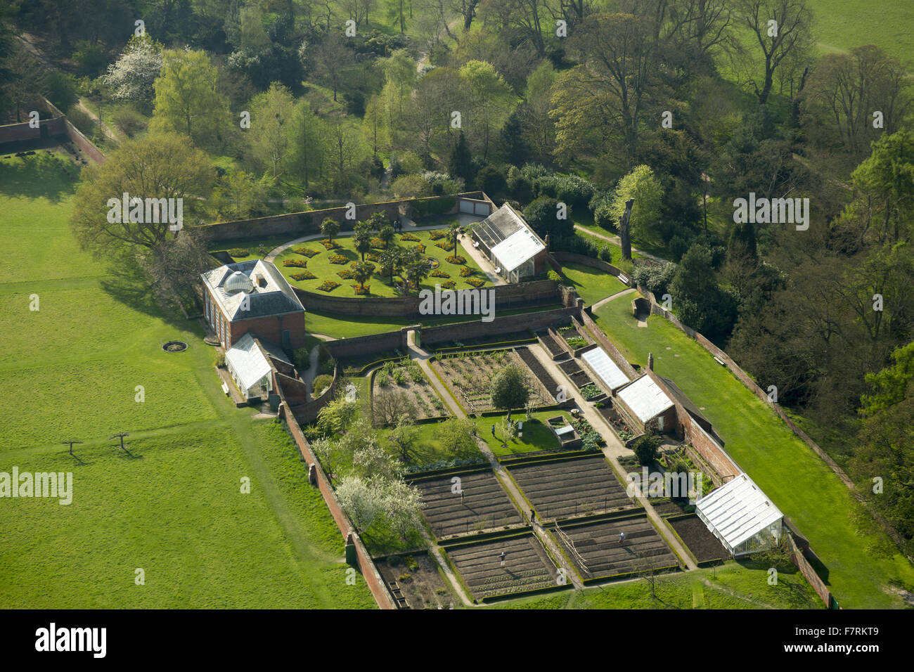 An aerial view of Calke Abbey, Derbyshire. There are beautiful, yet faded, walled gardens and the orangery, auricula theatre and kitchen gardens to explore. Stock Photo