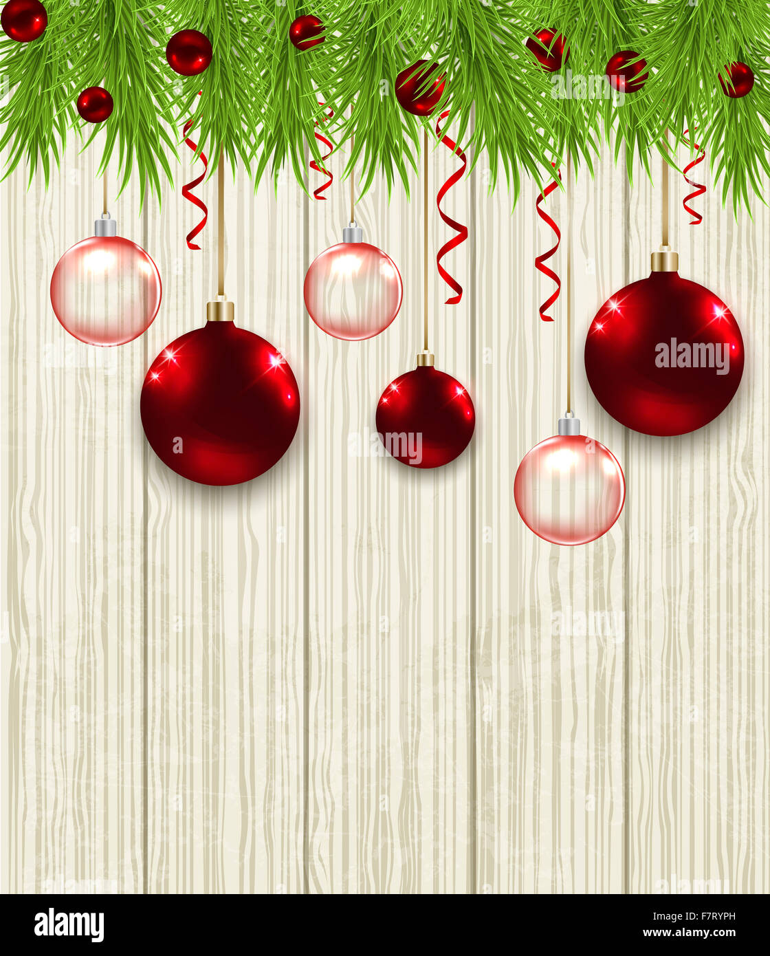 Wooden Christmas background with green fir branches and red baubles ...