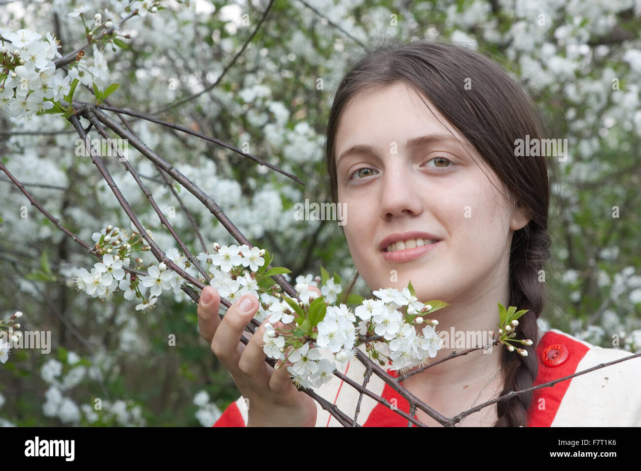 portrait of young woman in the blossoming garden Stock Photo - Alamy
