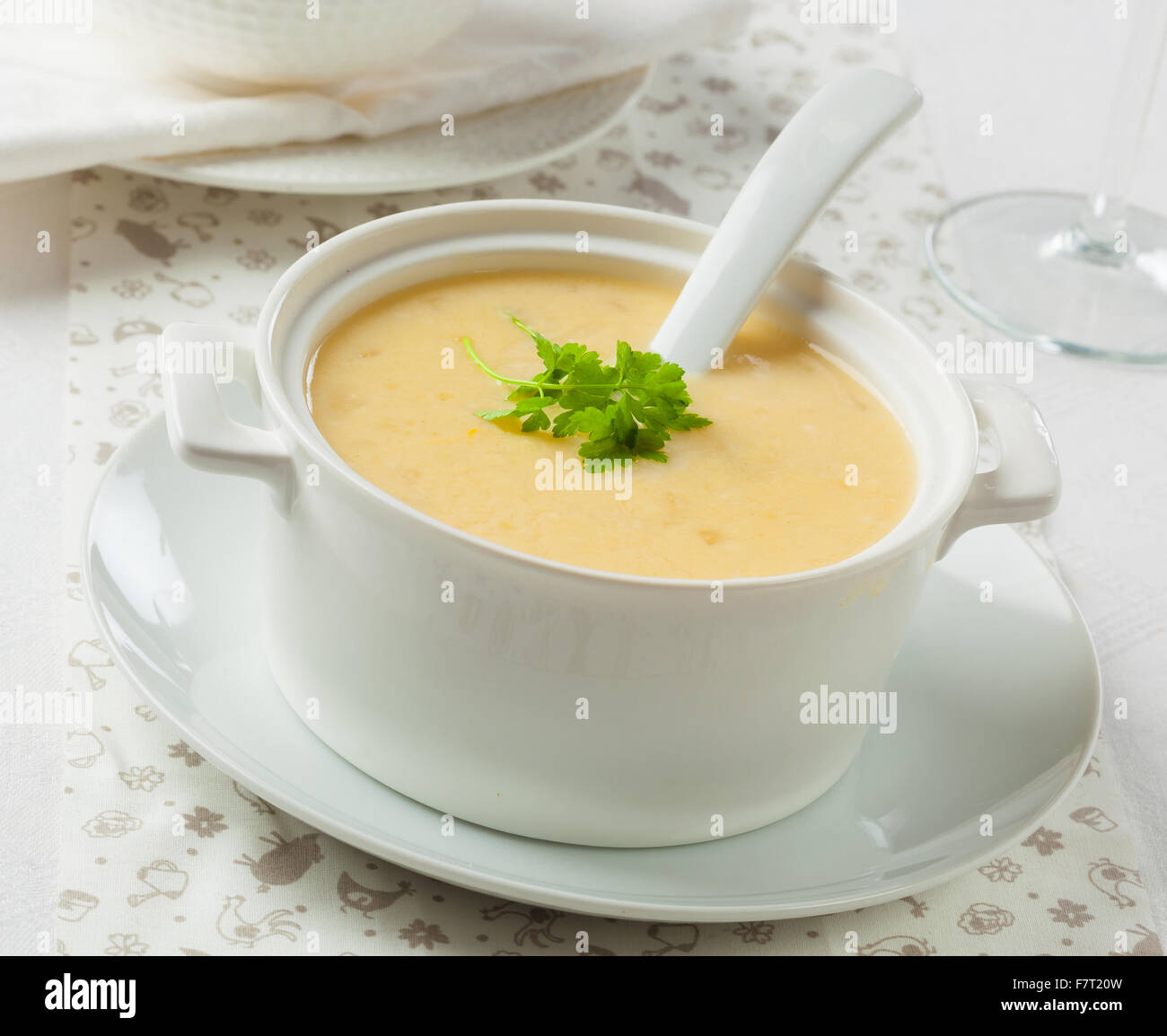 Cream soup in a bowl with a spoon Stock Photo