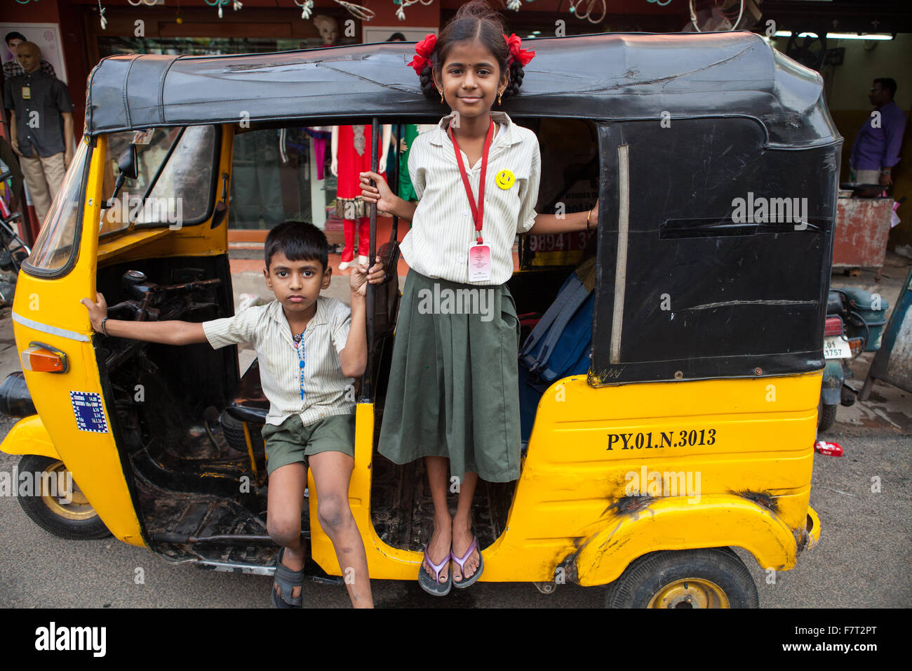 Schoolchildren in a motor rickshaw in Pondicherry, India Stock Photo