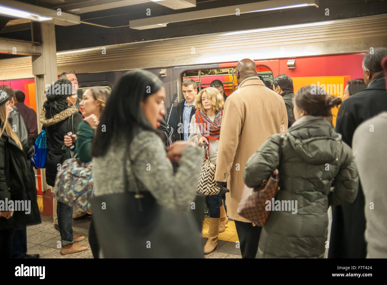 Travelers crowd the 42nd Street Shuttle in Grand Central Terminal in New York on Wednesday, November 25, 2015, the beginning of the great exodus over the Thanksgiving weekend.  On one of the busiest travel days of the year, estimated to be the busiest since 2007, travelers are likely to encounter heightened security due to recent terrorist attacks and global terrorism warnings.    (© Richard B. Levine) Stock Photo