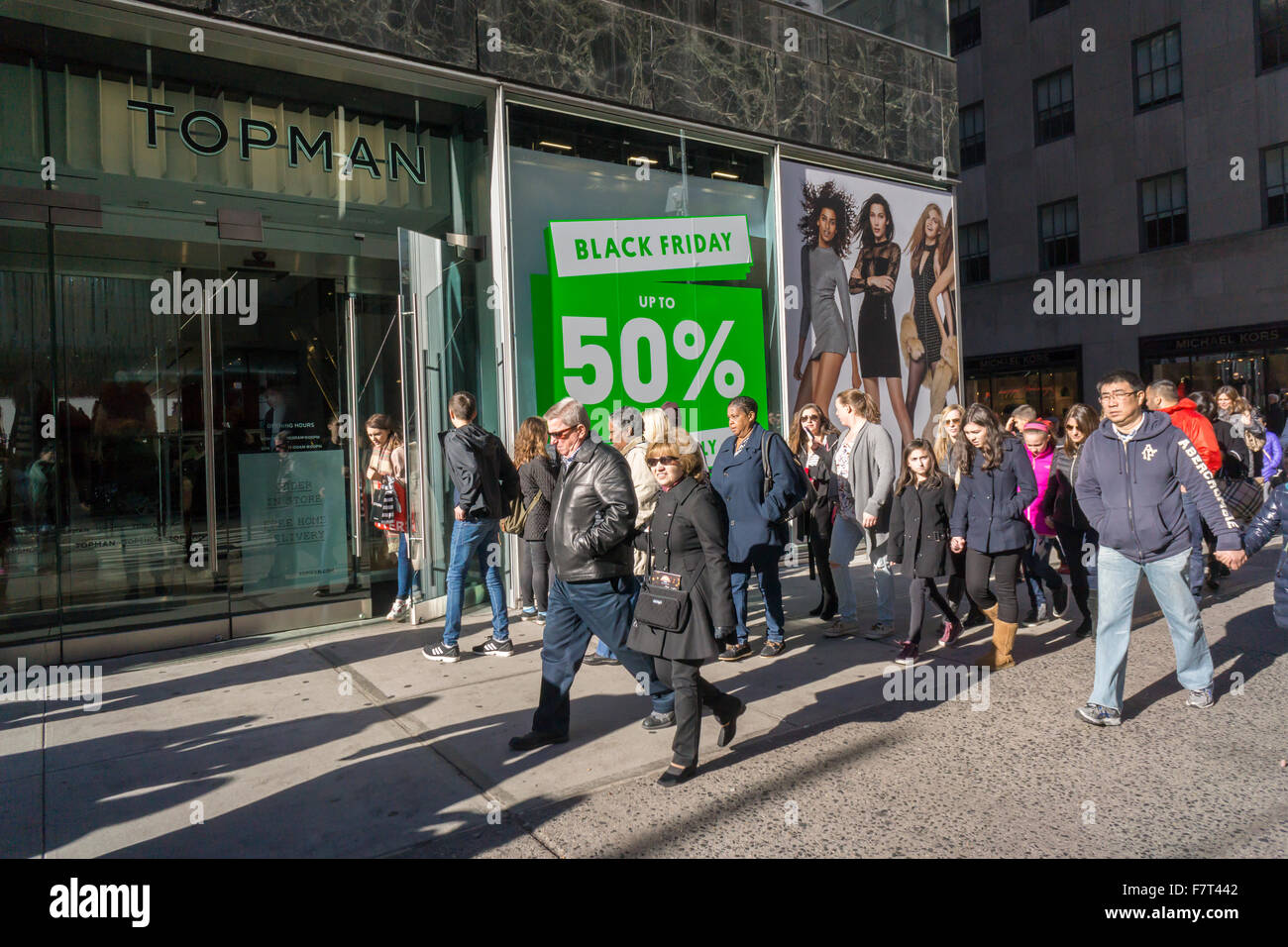 The Topshop Topman store in New York promotes its Black Friday deals on Sunday, November 29, 2015, over the Black Friday weekend. The National Retail Federation reported that many consumers opted out of the crowds and decided to shop online although the amount of people shopping in stores beat predictions. (© Richard B. Levine) Stock Photo