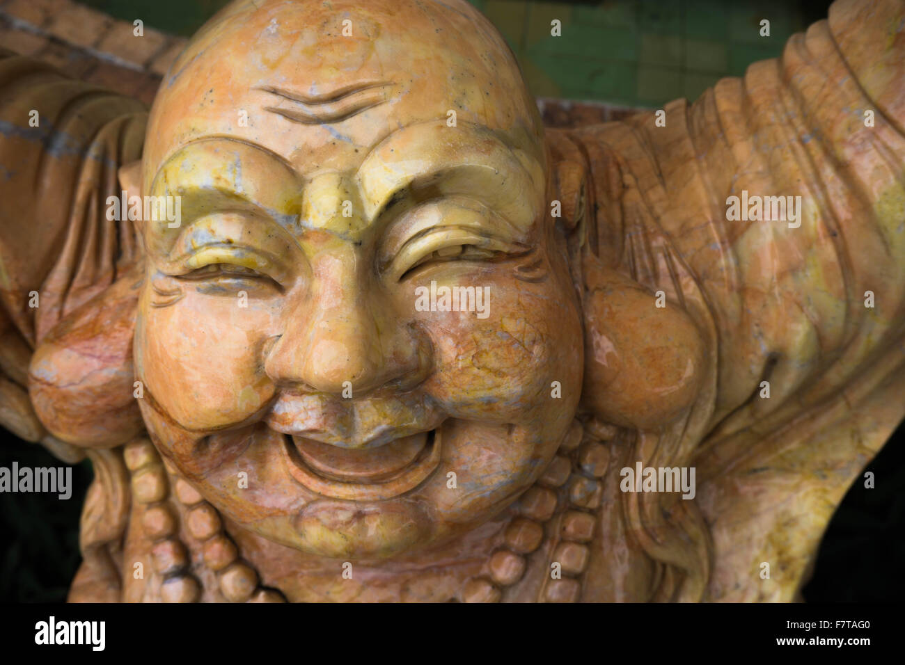 Laughing Buddha sculpture Stock Photo Alamy
