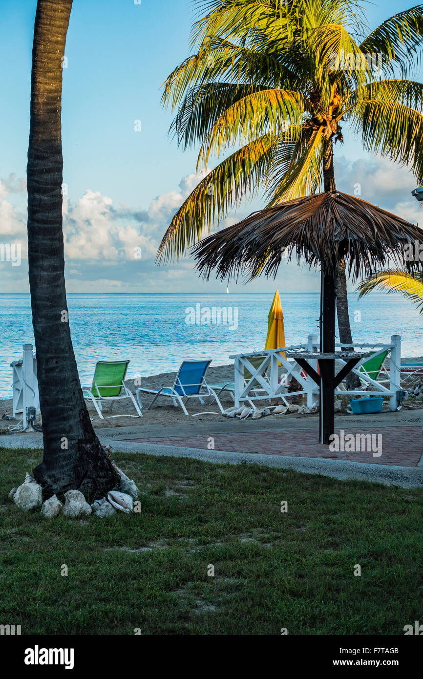 Palapa, beach chairs, umbrellas and view of the Caribbean sea from Cottages by the Sea resort on St. Croix, U.S. Virgin Islands. USVI, U.S.V.I. Stock Photo