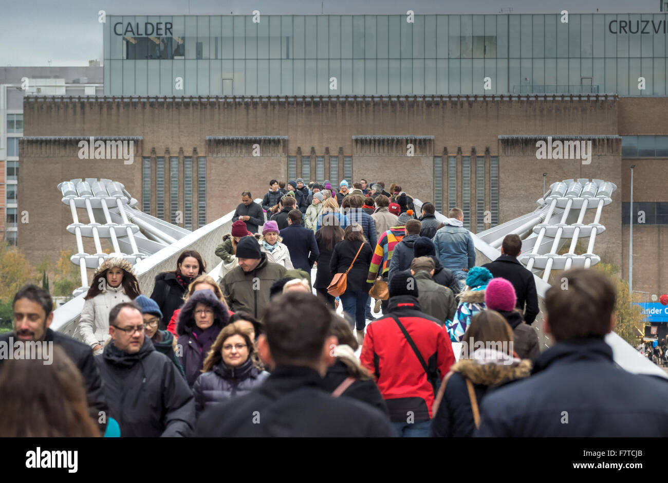 people crossing millennium bridge  London Stock Photo