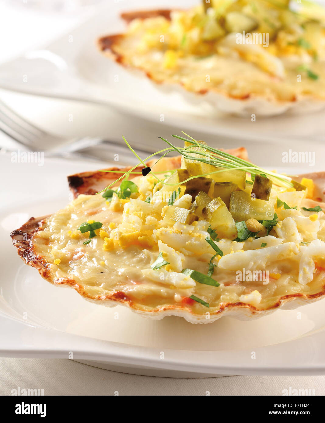 Scallop gratin with egg, and pickles Stock Photo
