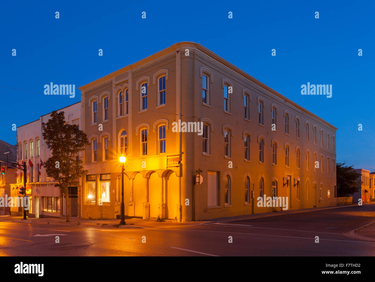 The historic Walton Hotel at  the corner of John Street and Walton Street in downtown Port Hope at dusk. Ontario, Canada. Stock Photo