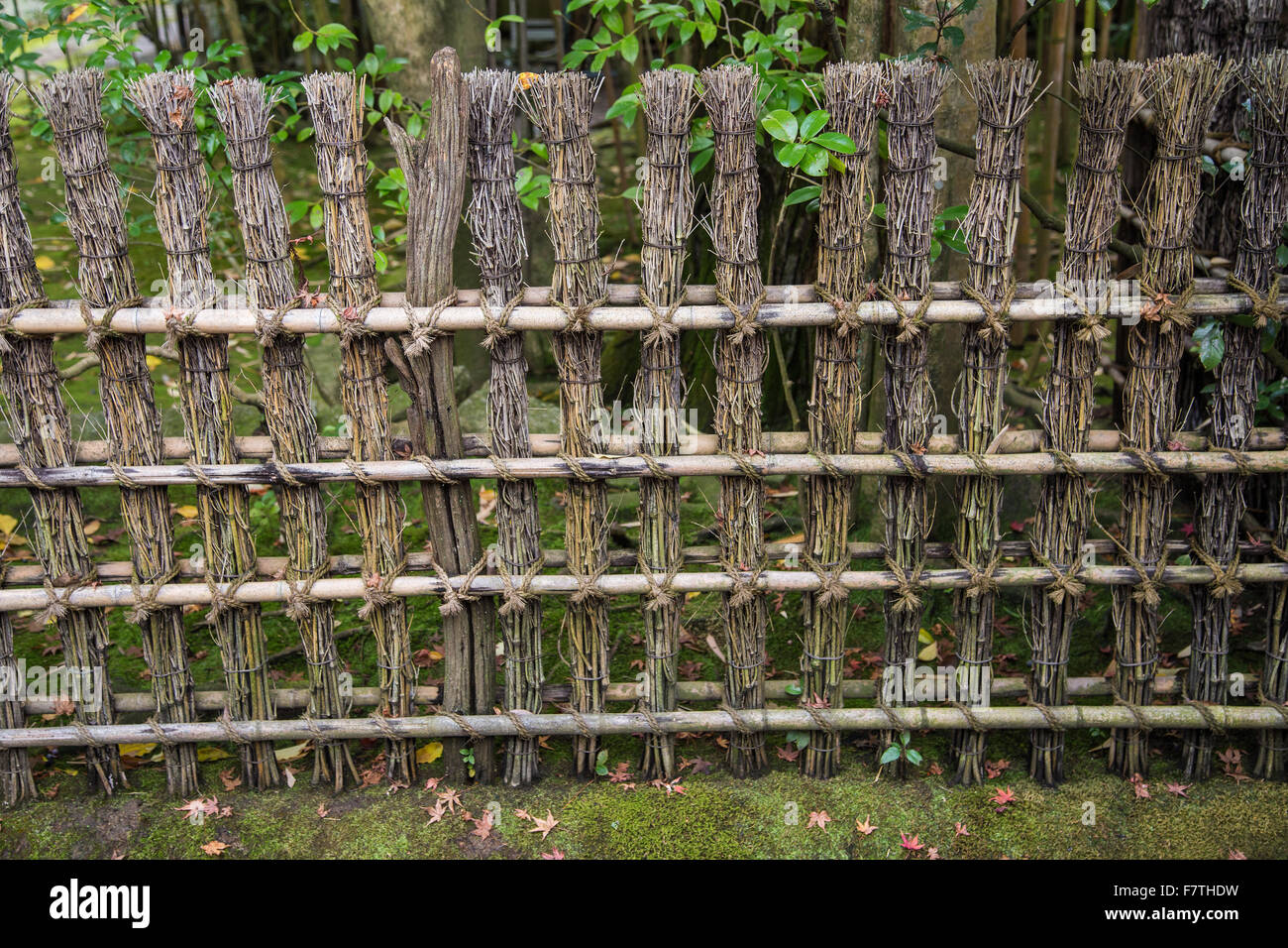 Fences and screens - kakine or kaki - are made of bamboo, wood and branches are used to define sections of a Japanese garden Stock Photo