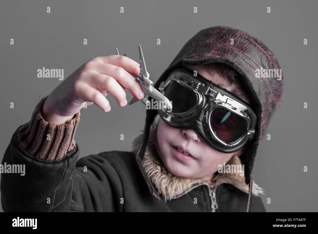 professional, child playing the aircraft pilot with hat and retro ...