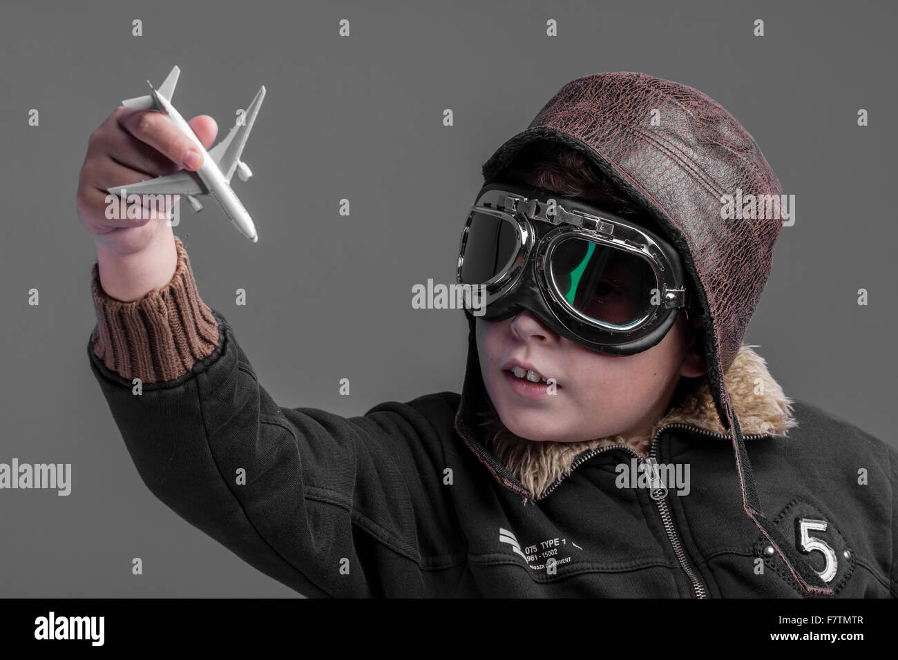 flight, child playing the aircraft pilot with hat and retro bomber ...
