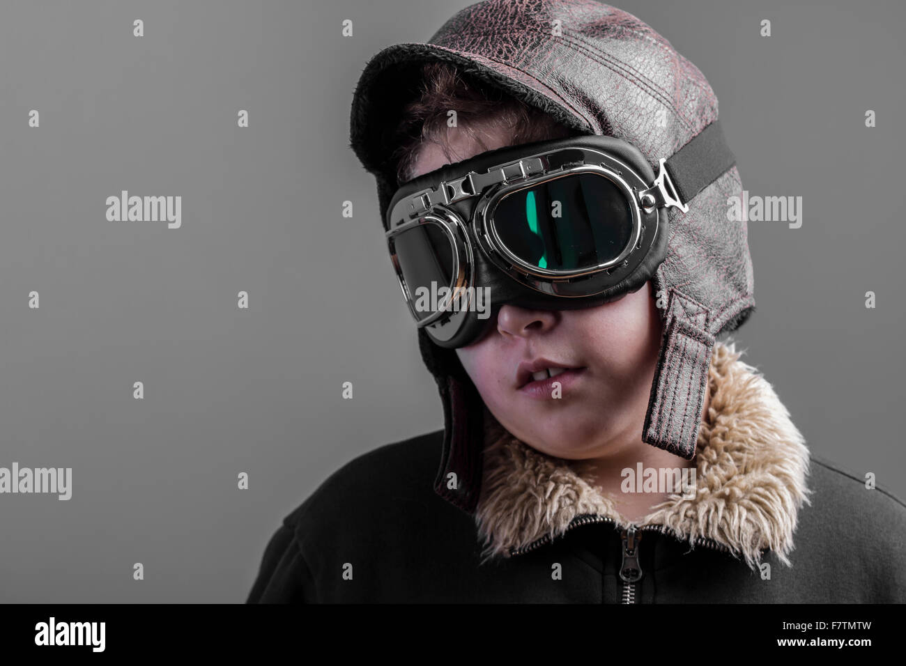 child playing the aircraft pilot with hat and retro bomber jacket Stock ...