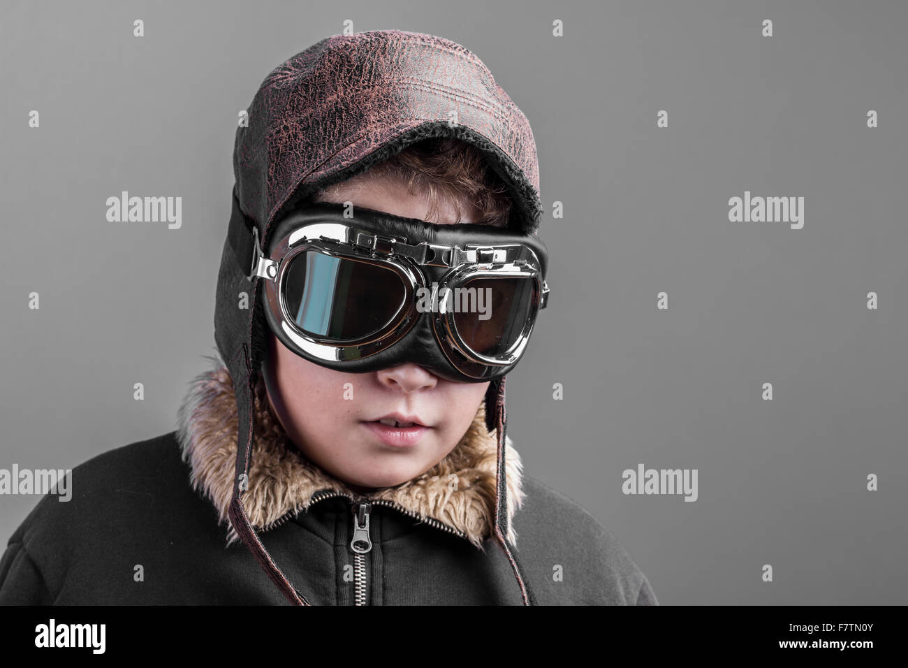 child playing the aircraft pilot with hat and retro bomber jacket Stock ...