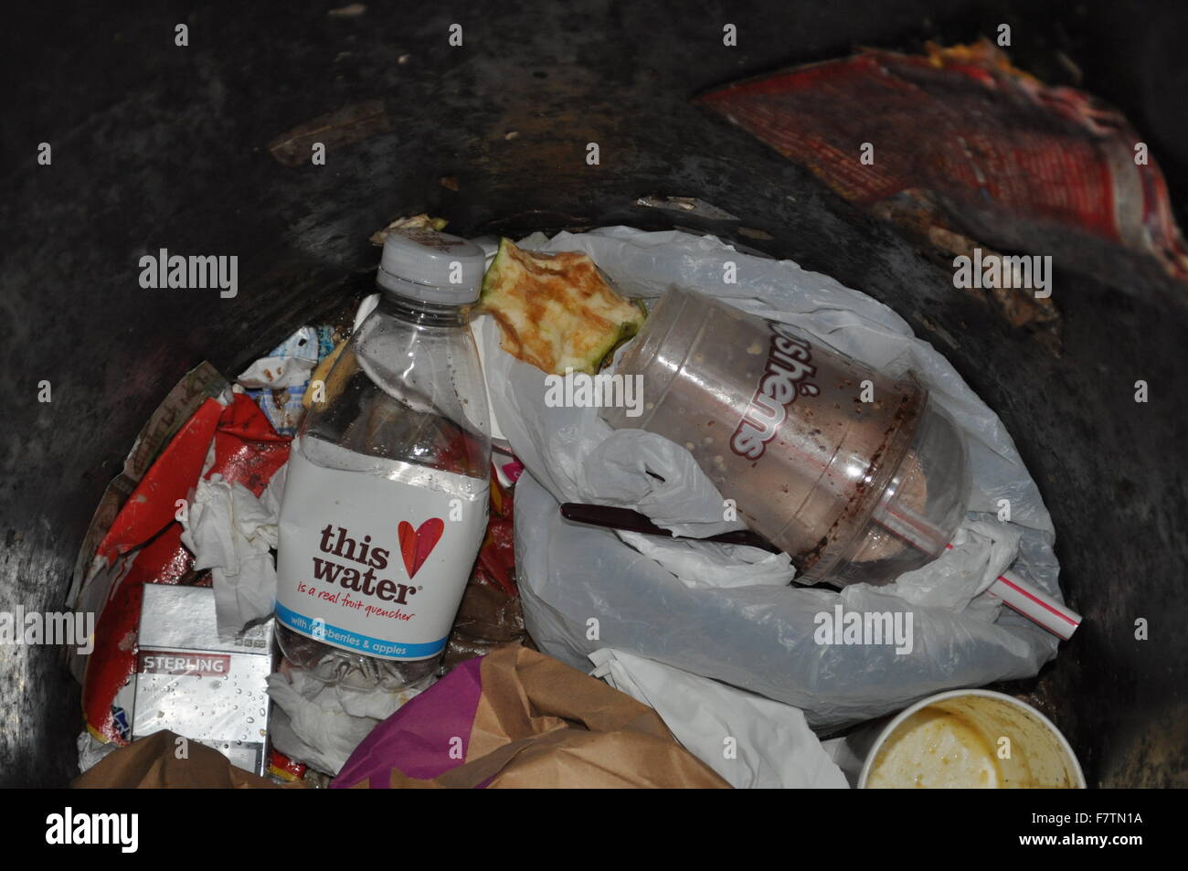 The contents of a rubbish bin at night Stock Photo Alamy
