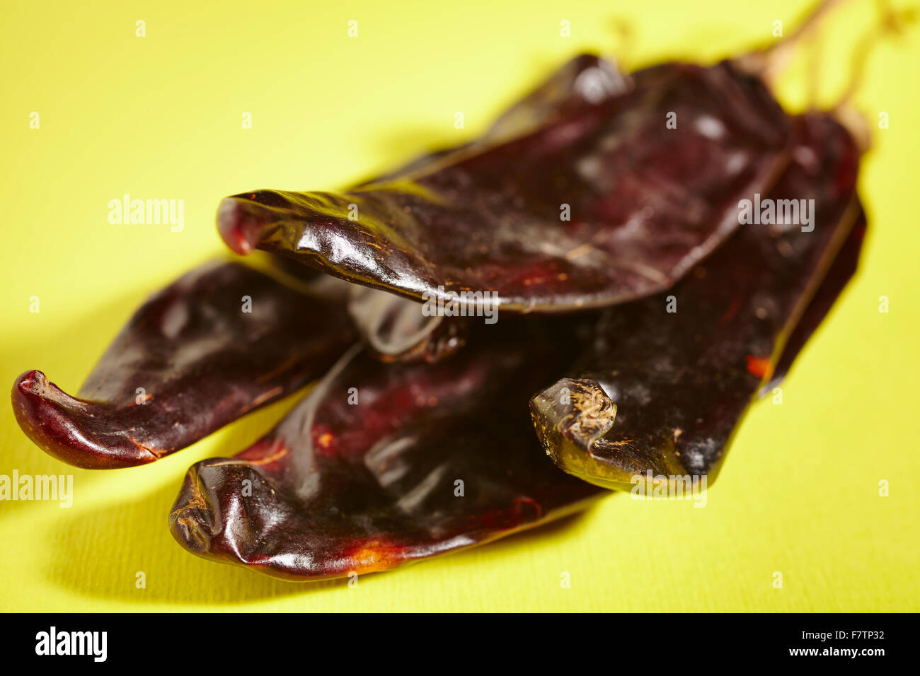 Whole, dried guajillo peppers from Mexico Stock Photo