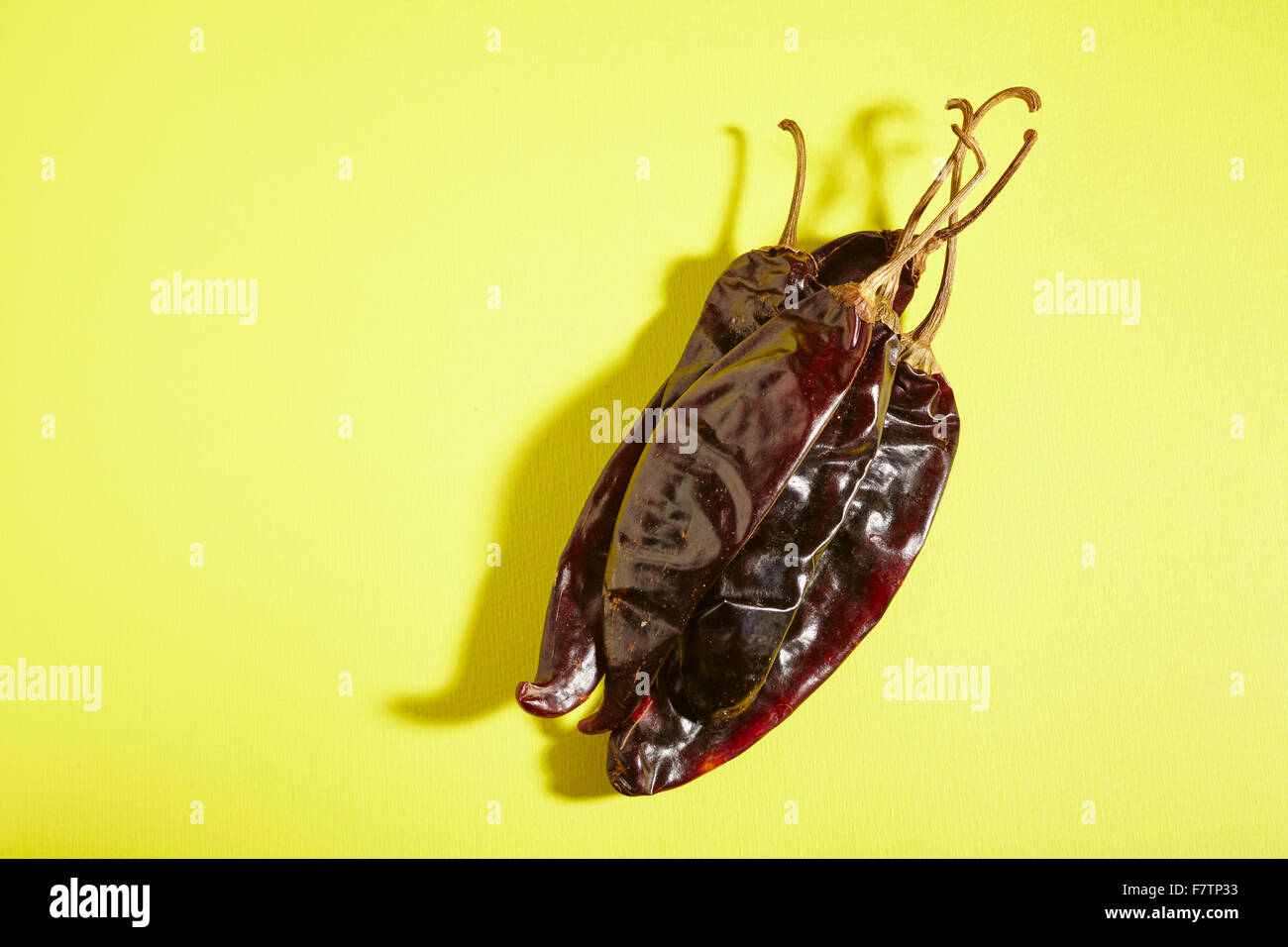 Whole, dried guajillo peppers from Mexico Stock Photo