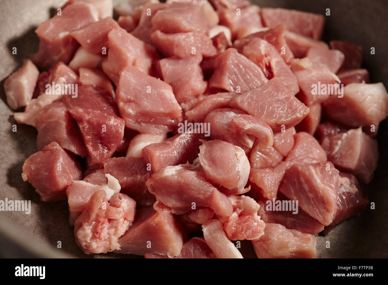 boneless raw pork in a stew pot Stock Photo