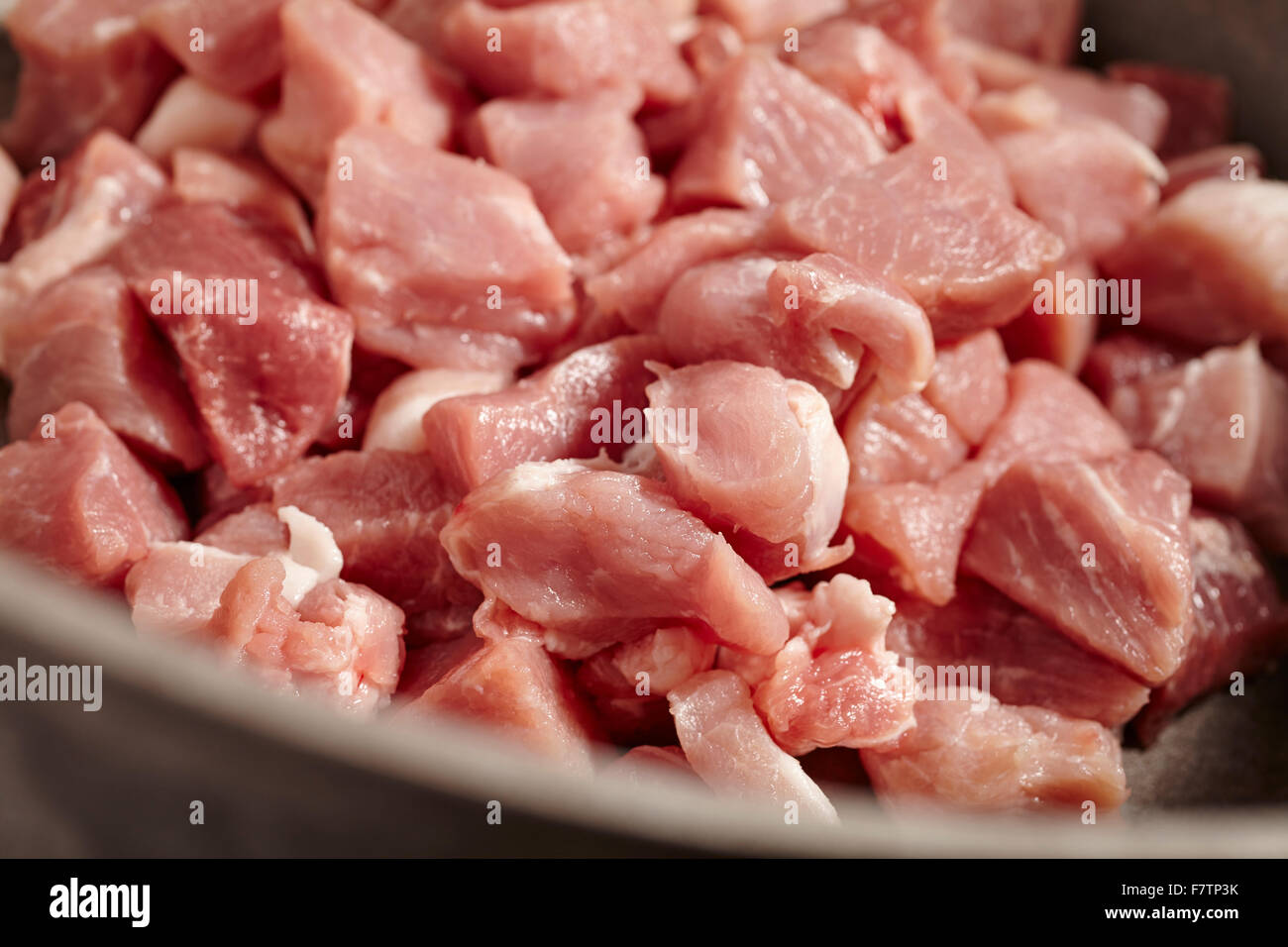 boneless raw pork in a stew pot Stock Photo