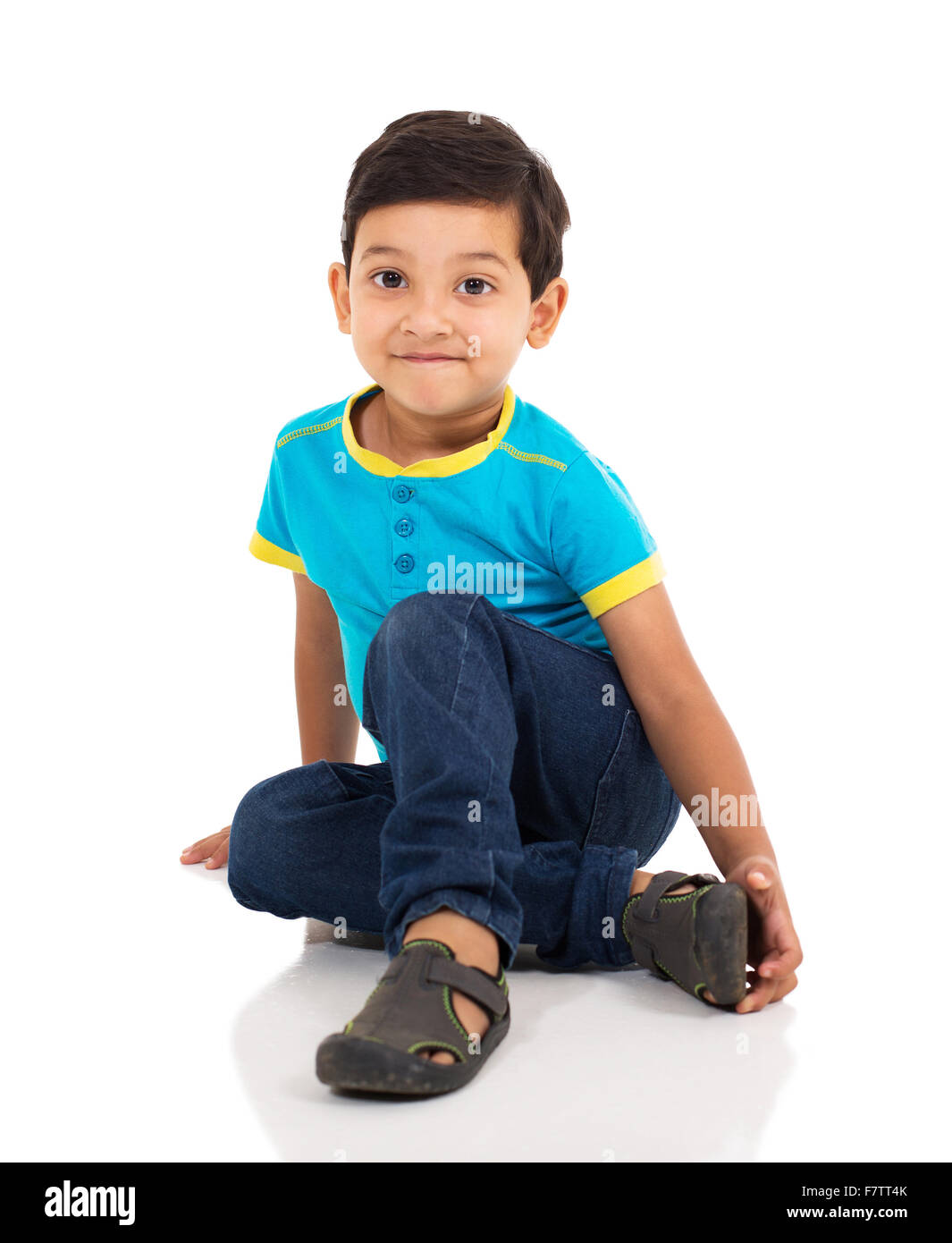 adorable little Indian boy sitting on the floor Stock Photo Alamy