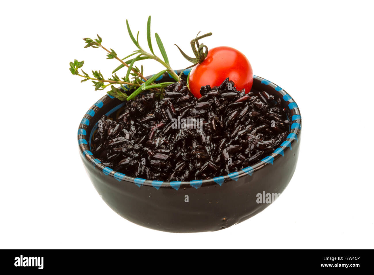 Black boiled rice with thyme Stock Photo