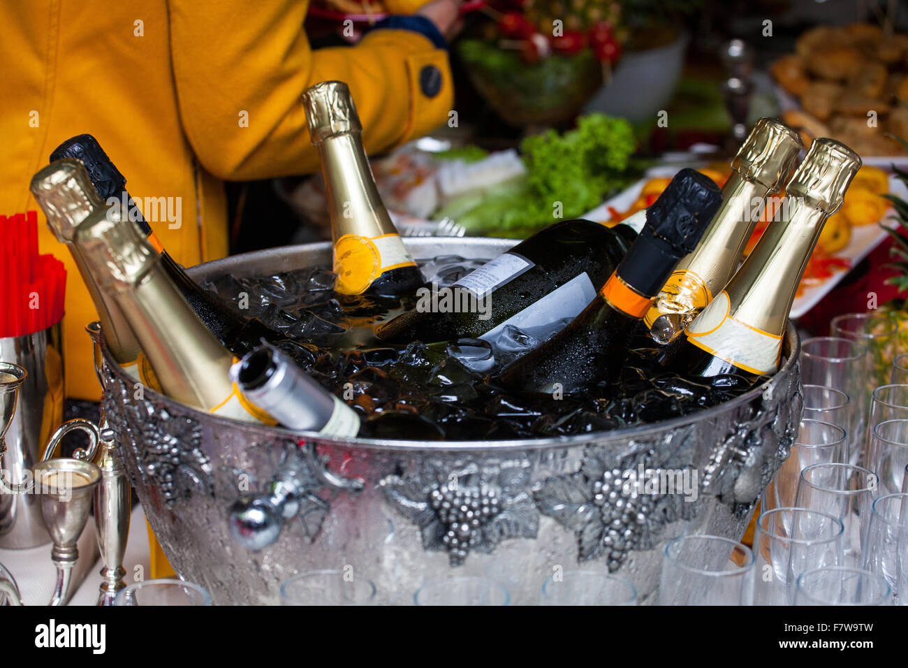 Bottles of sparkling wine in a tub with ice Stock Photo