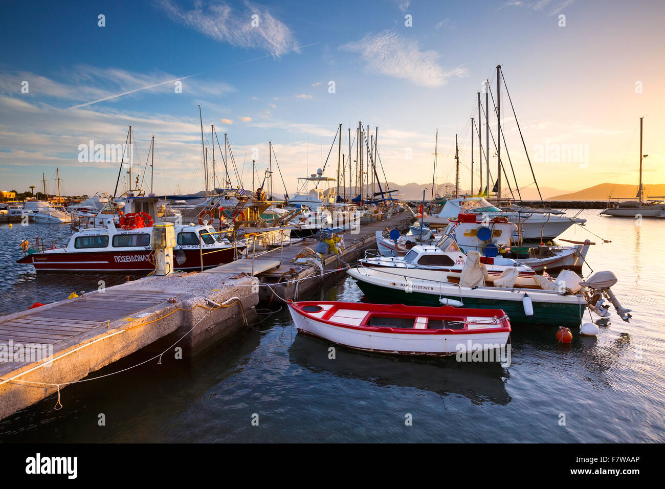 Fishing boats and sail boats in the port of Aegina, Greece Stock Photo