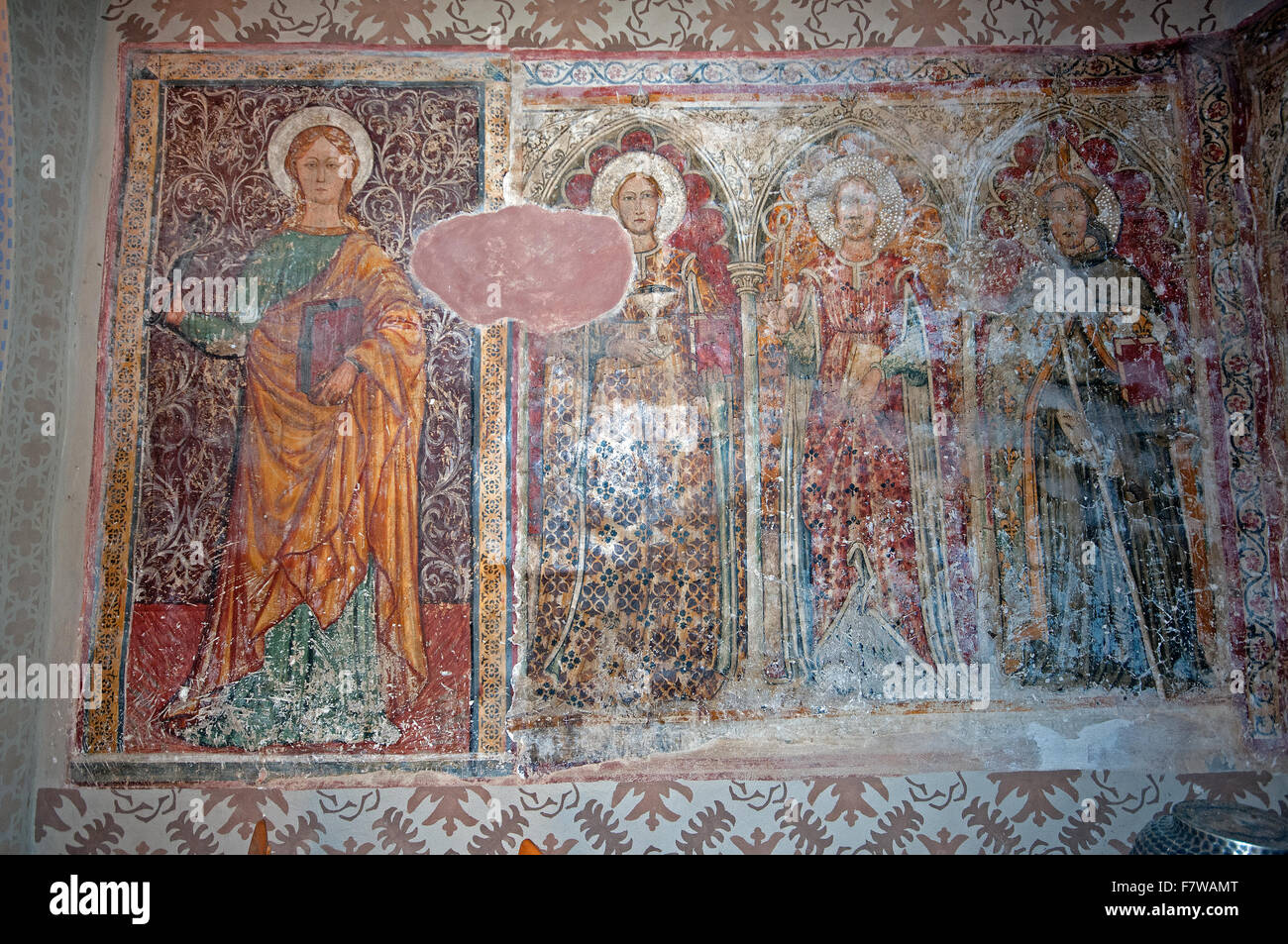 Ancient fresco of group of Saints in San Fortunato church, village of Cibottola, near Pietrafitta, Umbria, Italy Stock Photo