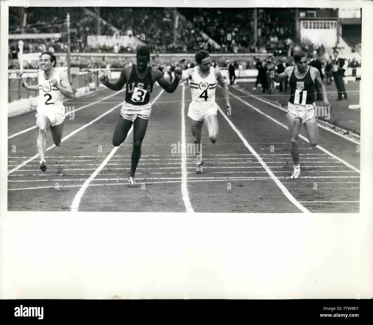 1965 - Finish of the 400 metres Vincent Matthews (No.3) of Queens, New York, breaks the tape to win the 400 metres race in the Great Britain V. United States Athletics RA meeting at the White City Stadium, London, today, August 12. Matthews won in a time of 45.7 seconds with Lee Evans of Madara, California (No.1) coming second in a time of 46.7 seconds, third was Colin Campbell (No.2) of Britain in a time of 47.6 seconds and fourth was Jim Robertson (No.4) of Britain in a time of 48.0 seconds. © Keystone Pictures USA/ZUMAPRESS.com/Alamy Live News Stock Photo
