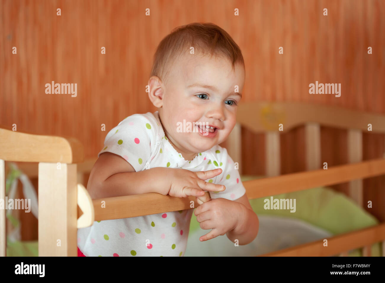 Happy baby of one year old in crib Stock Photo Alamy