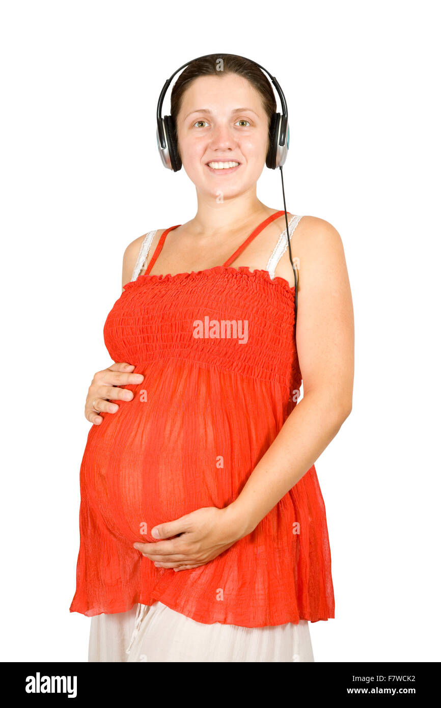 Happy pregnant woman listening to music on white backgroung Stock Photo ...