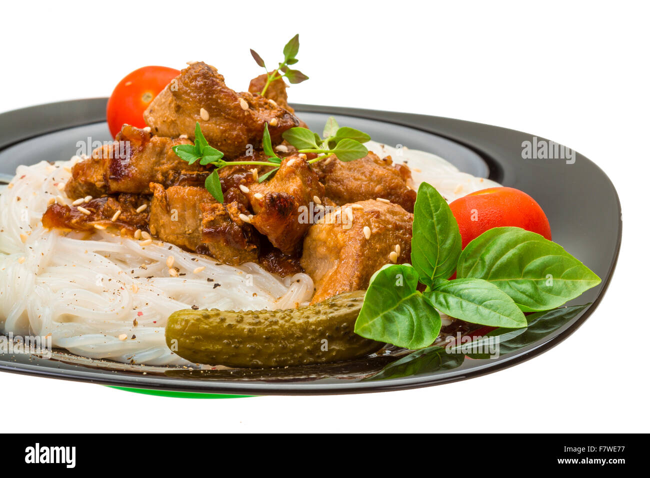 Rice noodles with pork, tomato and herbs Stock Photo Alamy
