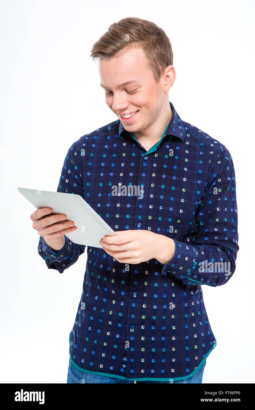Portrait of a smiling man using tablet computer isolated on a white background Stock Photo