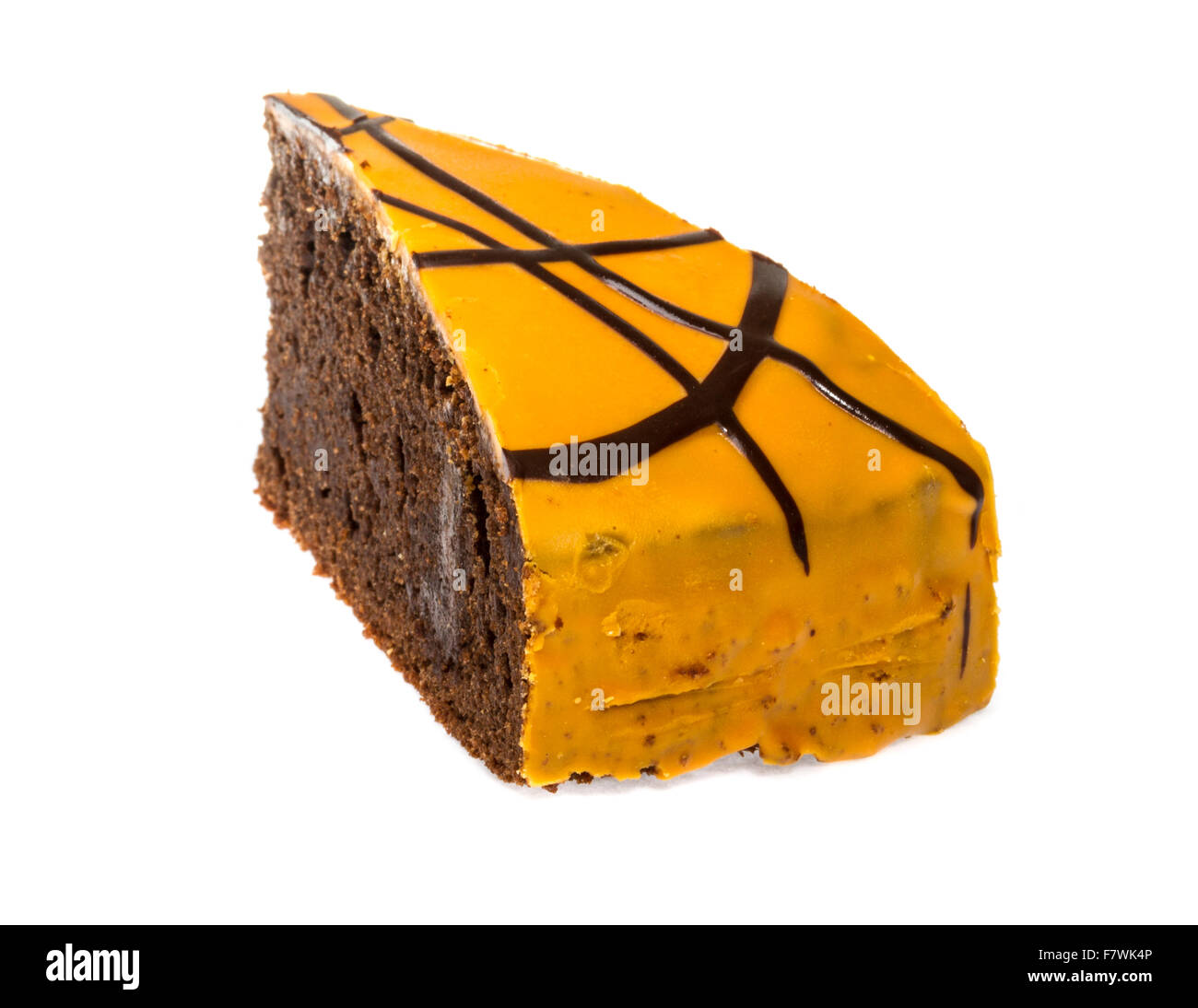 Piece of chocolate cake with icing on white isolated background Stock ...