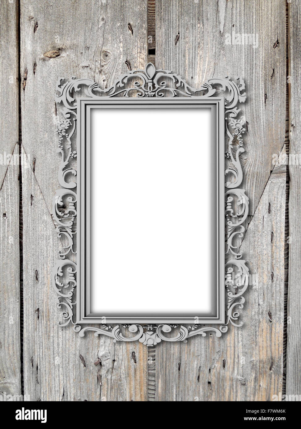 Single silver plated baroque frame on wooden boards background Stock Photo