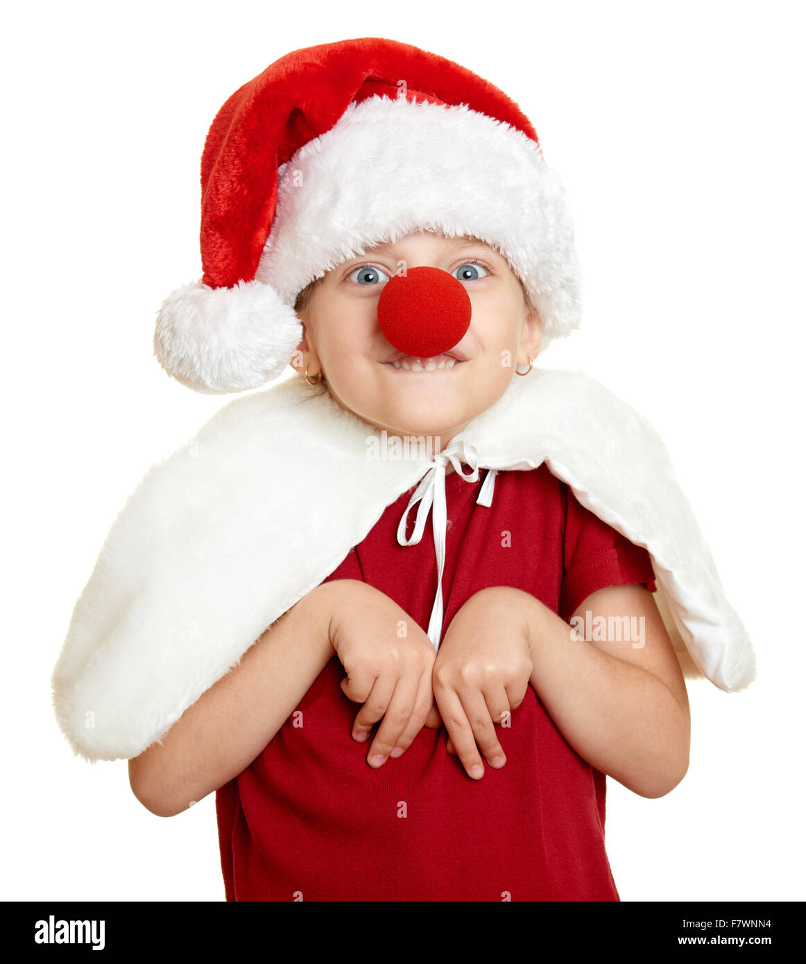 girl in santa hat with clown nose on white isolated Stock Photo