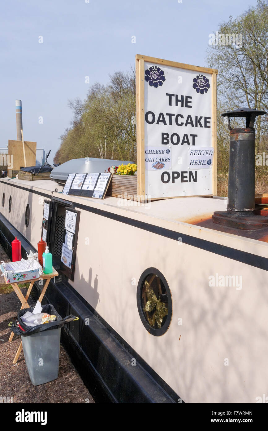 A narrow boat or barge called The B'oatcake on the canal selling a North Staffordshire delicacy called an Oatcake, Stoke on Trent, England, UK Stock Photo