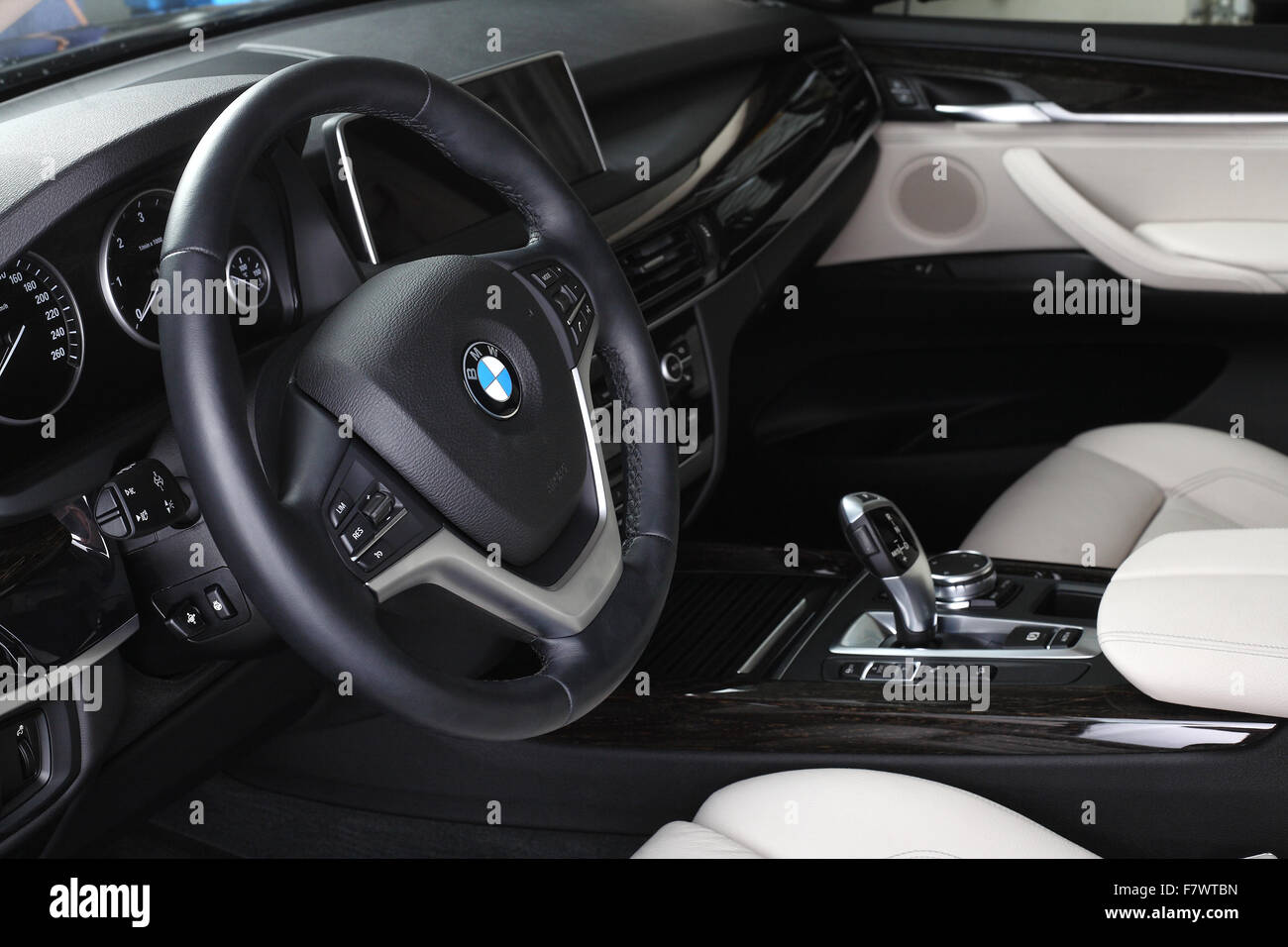 BMW X5. Interior of leather passenger compartment of the car in light-dark tones. 04.10.2015. Moscow. Stock Photo