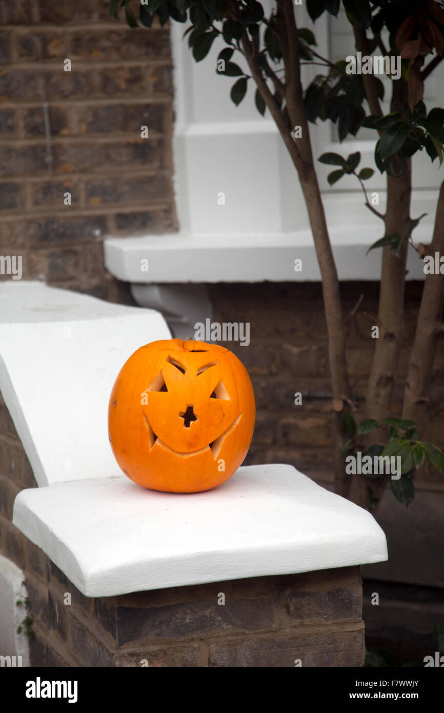 Pumpkin on House Doorstep - UK Stock Photo